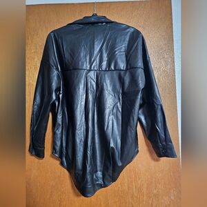 Long-sleeved leather like top.